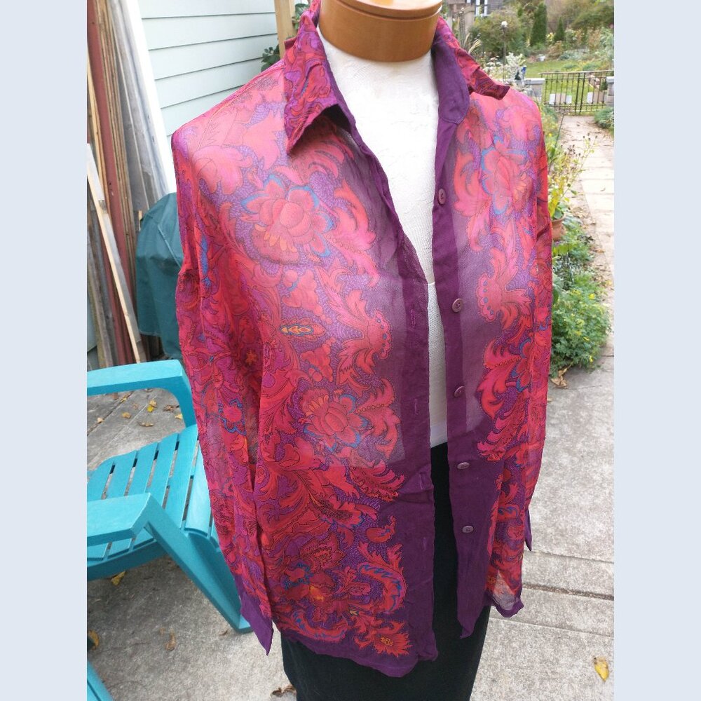 Blouse: Silk, burnt orange, ornate print, sleeveless. Size large - no tags